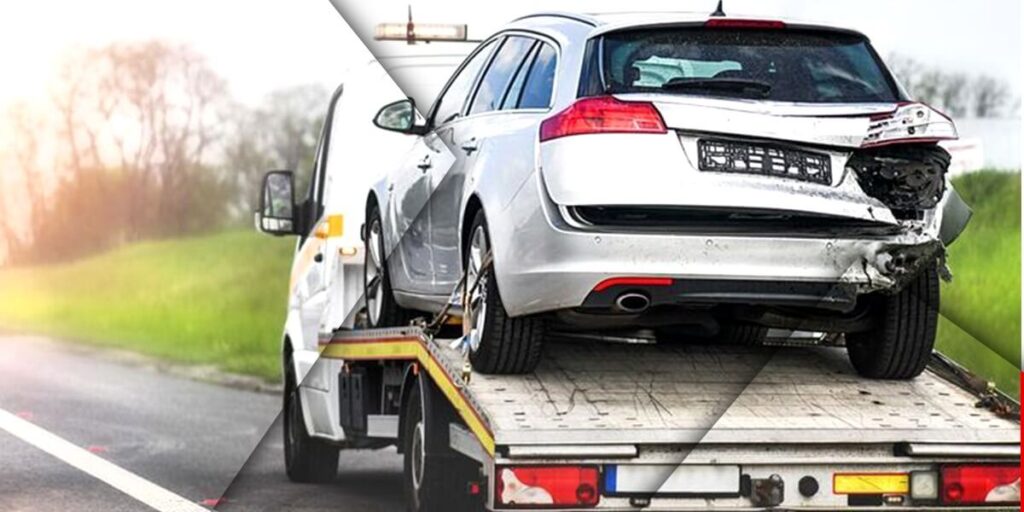 Image of a mobile breakdown towing vehicle safely transporting a damaged car